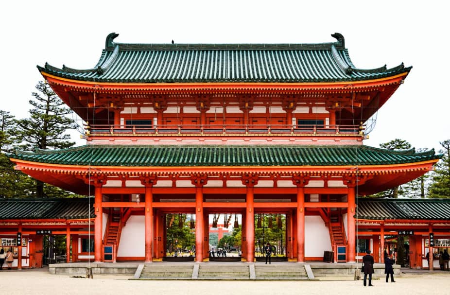 Bright red Asian temple with green roof