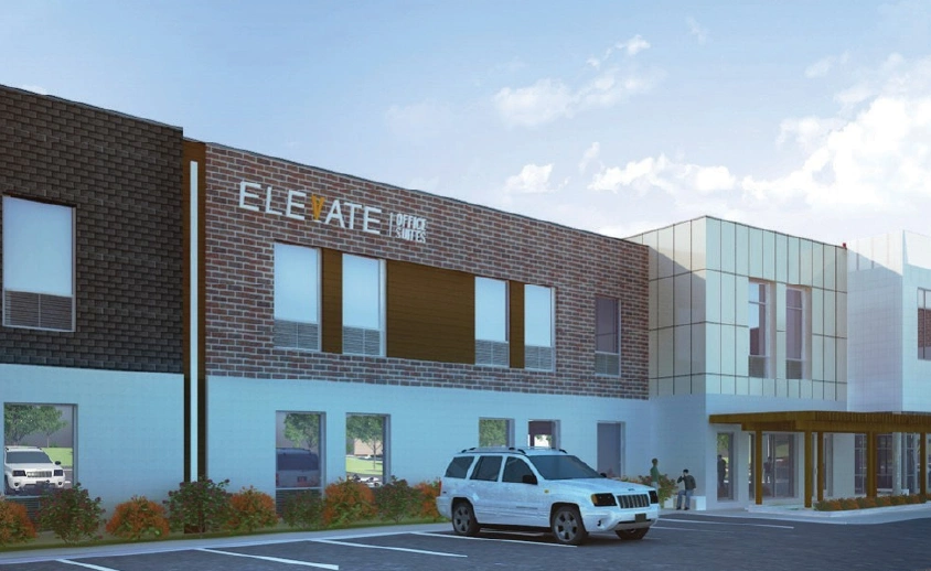 Elevate Office location featuring a two-story brick and stucco commercial building